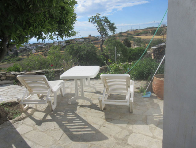 Paved yard with sunbeds